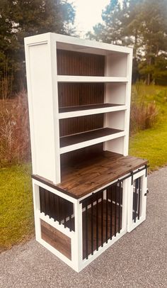 a dog house made out of an old bookcase