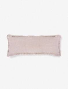 a pink pillow on a white background