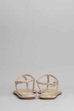 Upper: 100% Rhinestones Sole: 100% Leather Luxury T-strap Sandals With Single Toe Strap, Luxury T-strap Sandals With Removable Insole, Luxury T-strap Sandals For Beach, Gold Leather Sandals With Rhinestones, Luxury Gold T-strap Sandals, Elegant Embellished Toe Post Sandals, Luxury Summer T-strap Toe Post Sandals, Luxury T-strap Beach Sandals, Luxury Toe Post T-strap Sandals For Summer