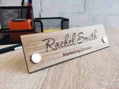 A beautiful, exclusive personalized desk stand with name. A perfect decoration for any office or anywhere where there is direct contact with the customer. Three types of beautiful wood to choose from. Each board has its own unique grain and color, which adds originality and character. Each name desk plaque is carefully hand-sanded and protected with colorless wood oil. Desk signs are made with a precise laser from solid wood and two metal supports.  Please write to us if you need signs in a diff Desk Signs, Engraved Name Plates, Office Desk Name Plates, Pyrography Ideas, Engraving Wood, Desk Plaques, Name Plate Design, Glowforge Ideas, Personalized Desk