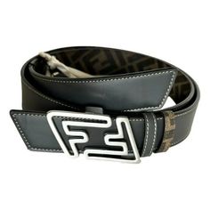 Expertly crafted in Italy, the Fendi Faster Belt features a silver buckle closure and is reversible, giving you versatility and style. This 1.3 inch brown and asphalt belt exudes luxury and authenticity, ensuring a statement-making addition to any outfit. Size 100. Silver FF logo buckle closure Reversible Made in Italy Size: 100/44 Comes with Fendi Box and Fendi dustbag Made in: Made in Italy Width: 1.6 Inch Color: Black and Asphalt grey (double sided) Material: Leather Model 7C0486 Size: one si Versus Versace, Fastest Man, Ff Logo, Brown Belt, Branded Handbags, Mens Big And Tall, Fendi Bags, Prada Bag, Belt Size