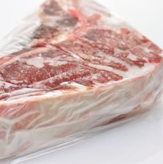 a piece of raw meat wrapped in plastic