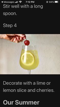 someone is holding a lemon slice and cherries in a wine glass with the caption,