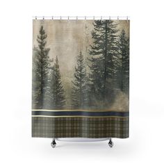 a shower curtain with trees on it and plaid fabric around the edges, in front of a white background