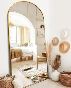 a large mirror sitting on top of a wooden table