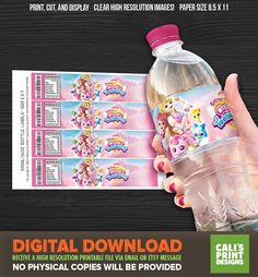 a hand holding a plastic water bottle with pink unicorns on it and the text, digital