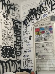 the walls are covered in graffiti and have been vandalized