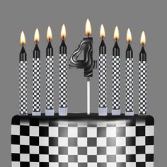 a black and white checkered cake with candles