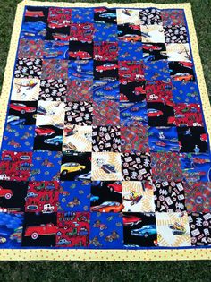 a quilt made to look like cars and trucks