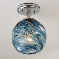 a blue and white swirled glass light fixture