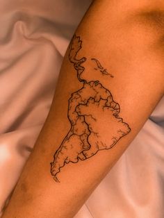 a person with a tattoo on their arm that has a map of the united states