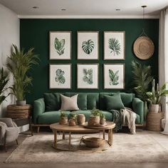 a living room with green walls and pictures on the wall, plants in vases