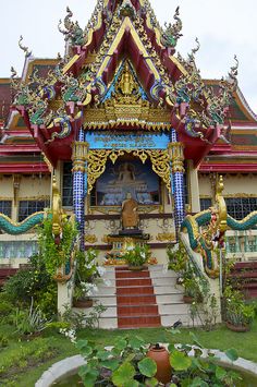 an elaborately decorated building with steps leading up to it