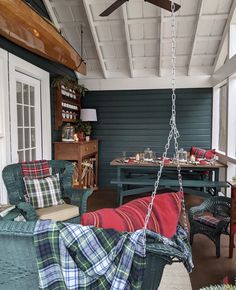 a living room filled with furniture and a ceiling fan