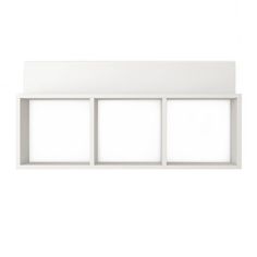 an empty white shelf with three windows on it