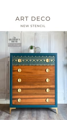 a blue and wooden dresser with brass knobs on it's sides, against a white wall