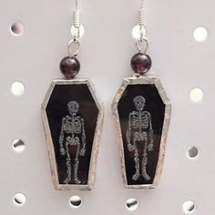 Skeleton On Stained Glass Coffin With Garnet Accents. Sterling Silver Ear Wires. By Gothic Gargoyle Glass Coffin, Gothic Gargoyles, Garnet Earrings, Earrings Color, Ear Wires, Black Silver, Garnet, Skeleton, Stained Glass