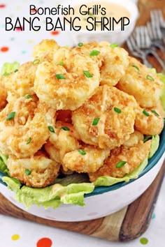 a bowl filled with fried food on top of a table