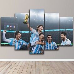 a group of soccer players holding the trophy in front of their faces on a wall