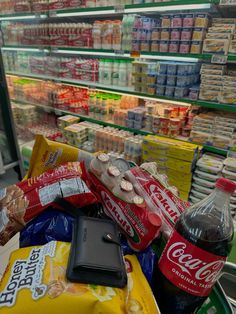 a grocery cart filled with snacks and drinks