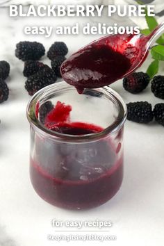 blackberry puree is being poured into a jar with berries around it and the words blackberry puree easy and delicious