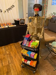 a skeleton sitting on top of a cart filled with candy