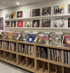 there are many records on the shelves in this store