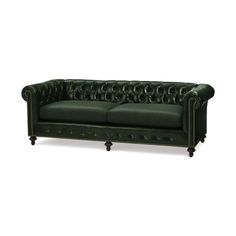 a green leather couch with buttons on the armrests and back rests against a white background