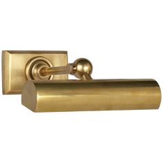 an antique brass toilet roll holder