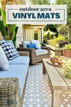 an outdoor area with wicker furniture and blue pillows on the couches is featured in this article