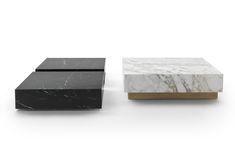 two black and white marble tables with gold trimmings on each side, one in the shape of a rectangle