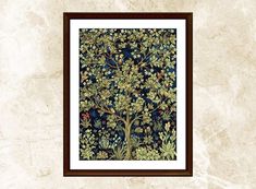 an ornate tree with many leaves and flowers on it, framed in a wooden frame