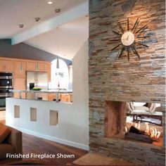 a clock mounted to the side of a stone wall in a living room next to a fireplace