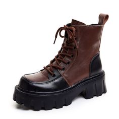 a pair of black and brown boots with laces