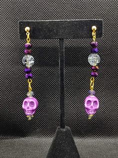 Our creative, handcrafted jewelry is hand made by a woman owned and operated small business with a passion for unique jewelry. We have tons of unique pieces that will make your outfit pop, or let your personality shine. Purple skulls and cracked glass beads catch the eye with these beautiful earrings. Light catching and bold these earrings will turn heads. Add these to your collection for Halloween and find yourself wearing them year round. These handcrafted earrings are 10mm wide by 73mm long f Creepy Earrings, Purple Skull, Diy Jewelry Projects, Diy Jewelry Unique, Halloween Earrings, Handcrafted Earrings, Bead Jewelry, Christmas Earrings, Find Yourself