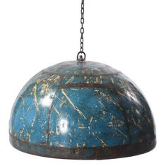 a blue and brown lamp hanging from a chain