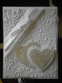 a white card with two hearts on it