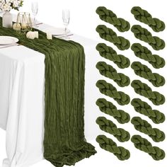 the table is set with green napkins and place settings