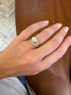 a woman's hand with a ring on it