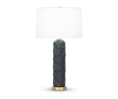 a table lamp with a white shade on it