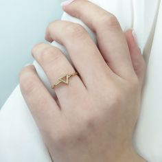 Tiny triangle ring, 9K 14K 18K Solid Gold, Triangle shape ring, Everyday geometric jewelry, Triangle geometric men's, Gold ring gift for her This tiny triangle ring has a minimal design, and you can wear it any day and combine it with other jewelry . It makes for an excellent gift for a loved one, without being extravagant. - Gold Kt: 9K, 14K and 18K Solid Gold - We can make all three Gold Colors: Rose Gold, Yellow Gold, White Gold - Band: 1,2mm ✔ Ready to Ship in 7-10 Business Days Each one of Minimalist Geometric Rings For Gifts, Minimalist Diamond Cut Signet Ring For Promise, Minimalist 14k Gold Trillion Cut Ring, Triangle Yellow Gold 14k Jewelry, Minimalist 14k Gold Geometric Jewelry, Geometric 14k Yellow Gold Jewelry, Minimalist Geometric Jewelry In 14k Gold, Gold 14k Trillion Cut Diamond Ring, Minimalist Geometric 14k Gold Jewelry