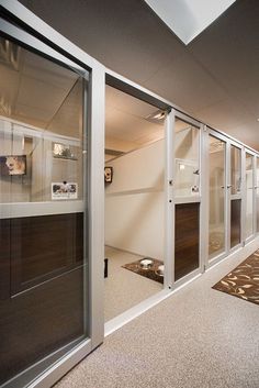 an empty room with sliding glass doors and carpet