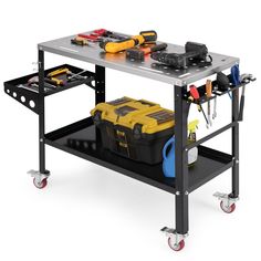 a workbench with tools on the top and two plastic bins under it