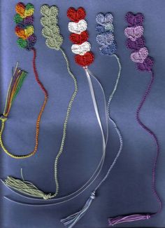 several crocheted items are arranged on a blue background, including yarn and thread