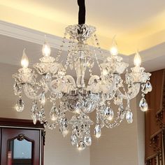 a crystal chandelier hanging from the ceiling