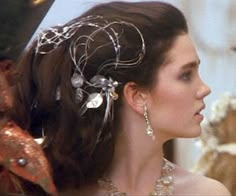 a woman wearing a tiara and jewelry in a scene from the princess bride