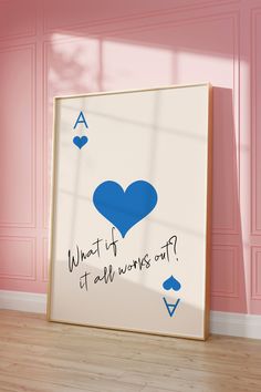 a blue heart is on the wall next to a white frame with words that read what if it's all wrong?