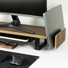 an apple computer sitting on top of a wooden desk next to a keyboard and mouse