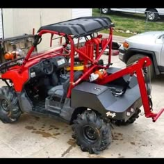 a red utility vehicle parked in front of a building