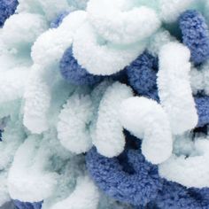 blue and white snow flakes piled on top of each other